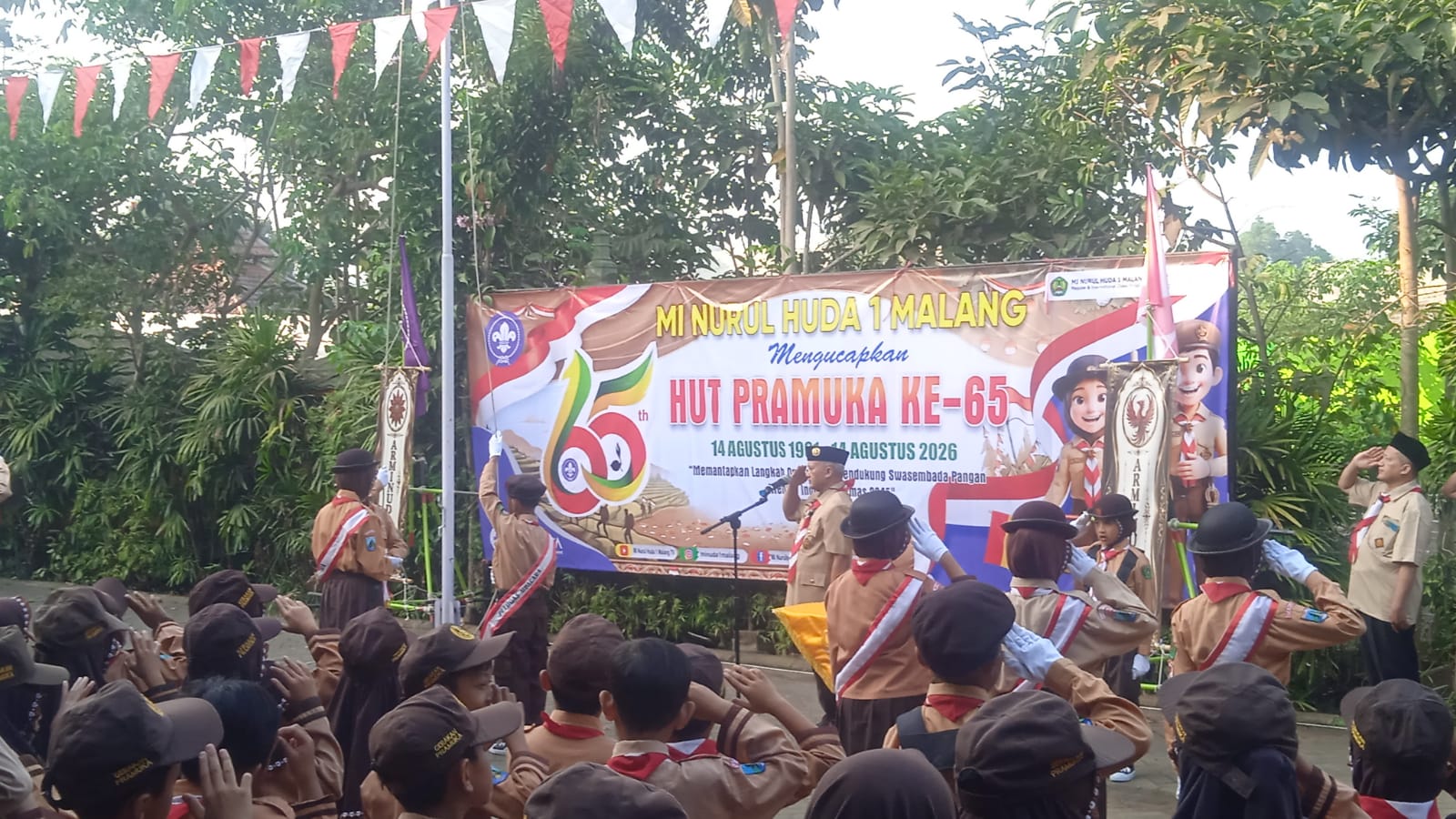 Meneguhkan Semangat Pramuka, Memantapkan Langkah Menuju Indonesia Emas 2045  Peringatan Hari Pramuka ke-65 Tahun 2026 di MI Nurul Huda 1 Malang